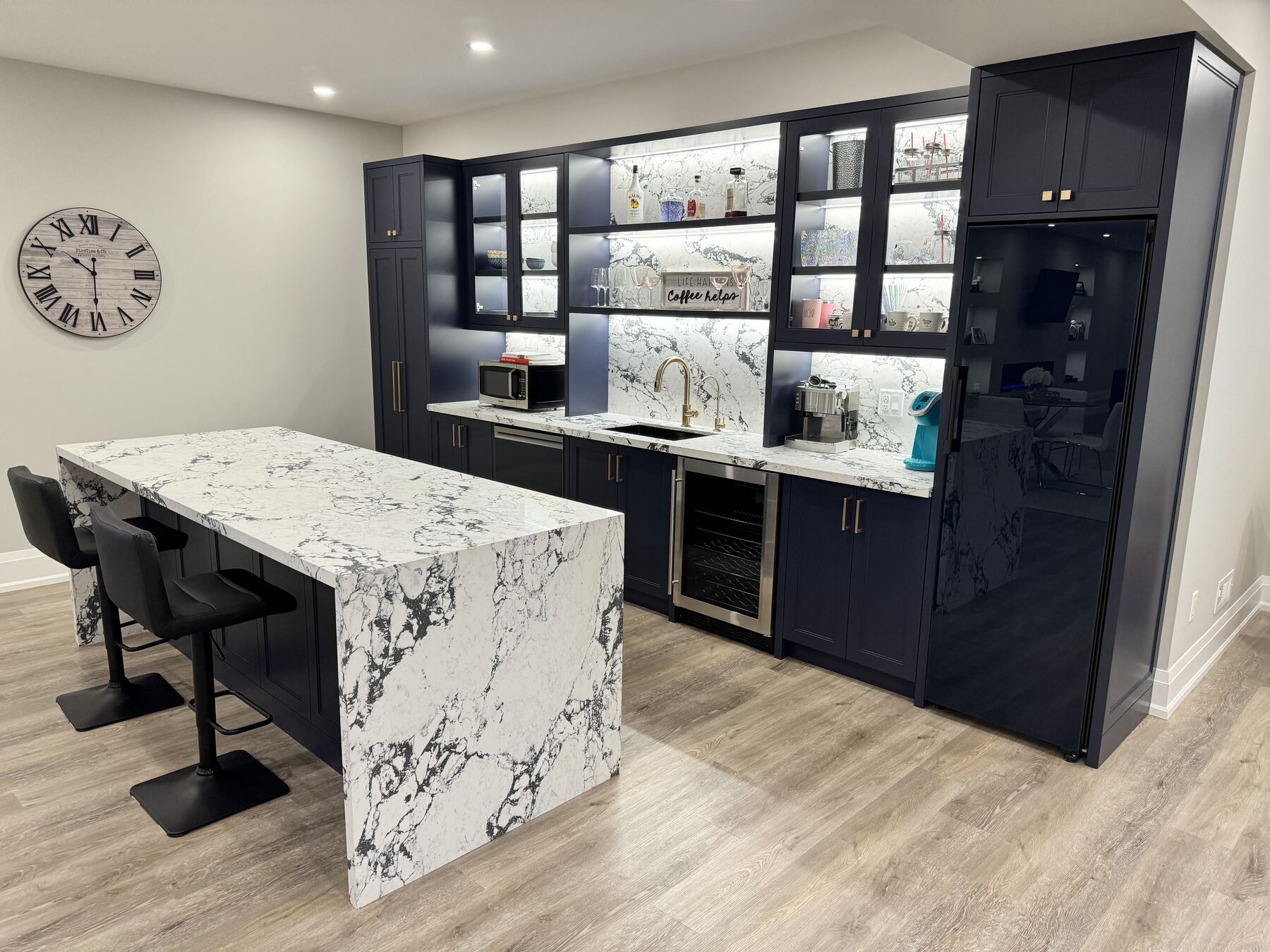 Custom kitchen island with marble waterfall edges — Desire Basements kitchen renovation GTA