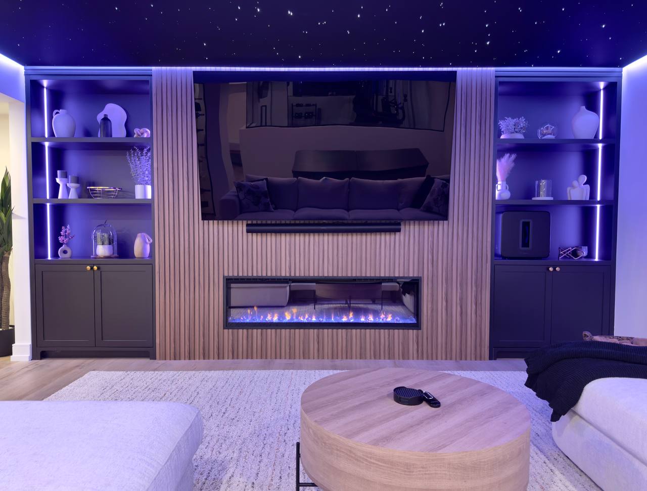 Living room media wall with fireplace — whole-home renovation in the GTA